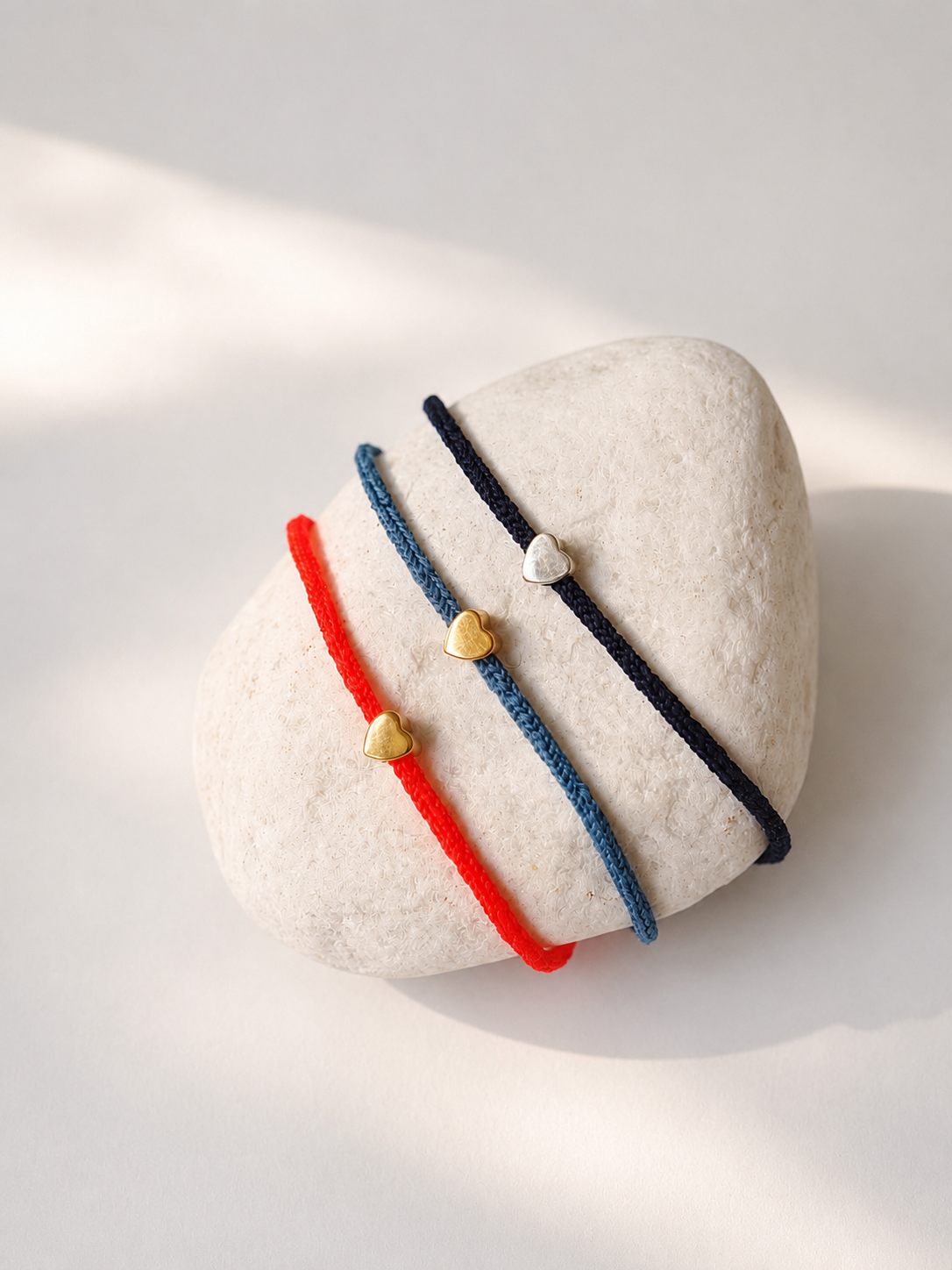 Braided Heart Bracelets on Stone
